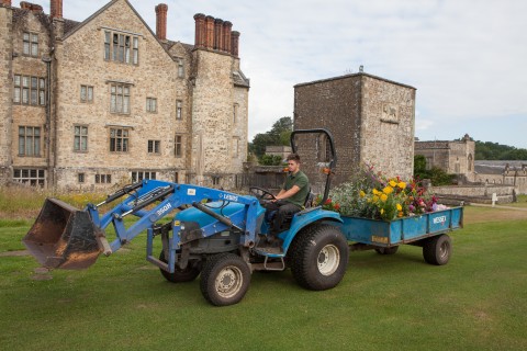 The tractor arriving at the house.