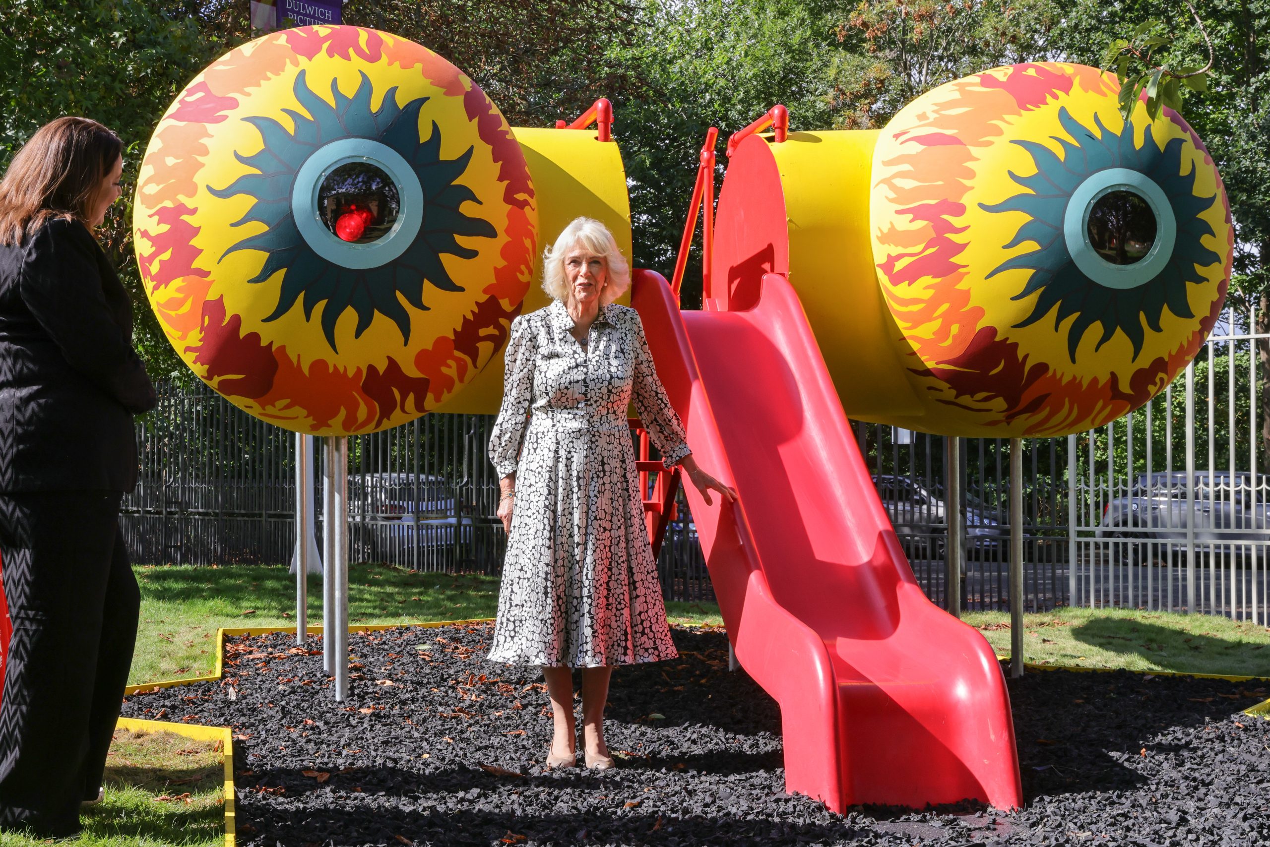 The Queen in front of Harold Offeh's whimiscal slide